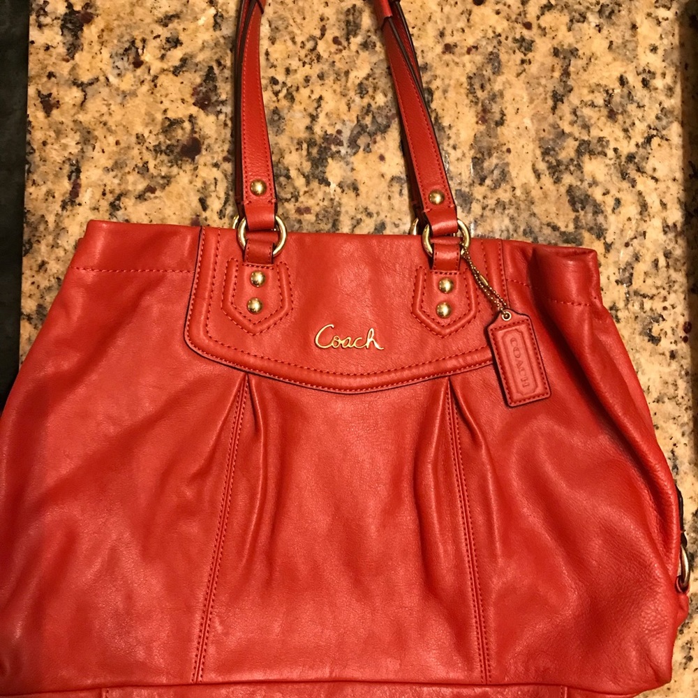 Coach orange leather medium size tote bag.